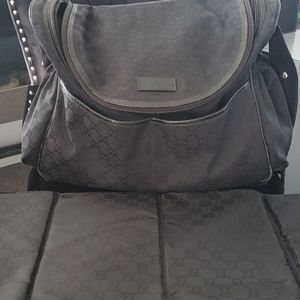 Monogram Gucci diaper bag